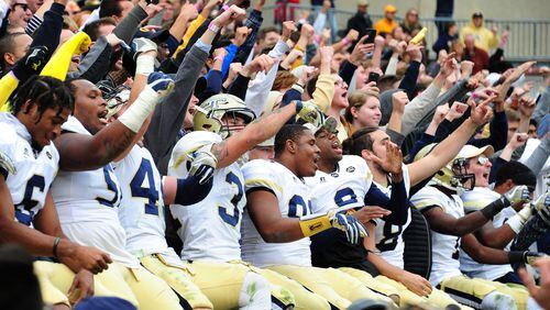 ATLANTA, GA - NOVEMBER 11: Members of the Georgia Tech Yellow Jackets celebrate with fans after the game against the Virginia Tech Hokies on November 11, 2017 at Bobby Dodd Stadium in Atlanta, Georgia. (Photo by Scott Cunningham/Getty Images)