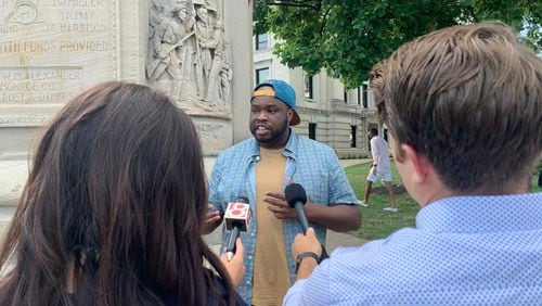 Vauhxx Booker, a civil rights activist and member of the Monroe County Human Rights Commission in Bloomington, Indiana, speaks to reporters Monday after being the target of an "attempted lynching" on the Fourth of July. Booker said a group of white men claimed he was trespassing on private property at Lake Monroe and attacked him and a group of friends who were there to watch an eclipse. One of the five assailants yelled "get a noose" during the alleged attack.
