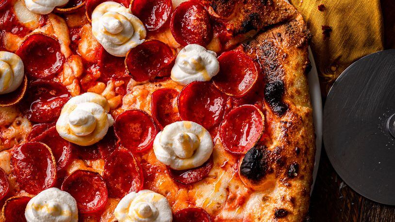 Topped with tomato sauce, fresh mozzarella, Parmesan, pepperoni, plus dabs of ricotta and hot honey, the Hot Honey Char pizza is a satisfying combination of savory, sweet, salty and spicy. RYAN AARON PHOTO