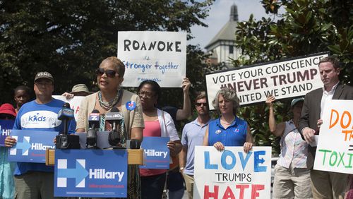 Anita Price, vice-mayor of Roanoke, Va., addresses the media and supporters during a news conference at the Wells Avenue Plaza to reject Republican presidential nominee Donald Trump and to support Democratic presidential candidate Hillary Clinton, Monday, July 25, 2016, in Roanoke. (Erica Yoon/The Roanoke Times via AP)