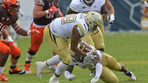 Georgia Tech defensive lineman Antwan Owens (89) recovers the ball after Bowling Green quarterback Jarret Doege fumbled during the second half Saturday, Sept. 29, 2018, at Bobby Dodd Stadium in Atlanta.  Georgia Tech won 63-17 over the Bowling Green.