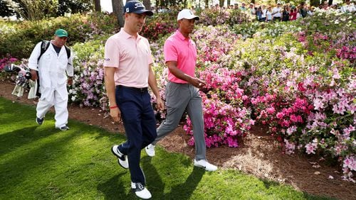 Justin Thomas amd Tiger Woods of the United States walk on the seventh hole  during a practice round prior to the start of the 2018 Masters Tournament at Augusta National Golf Club on April 2, 2018 in Augusta, Georgia.  (Photo by Jamie Squire/Getty Images)