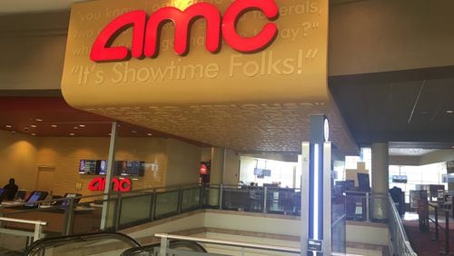 A balloon display being popped outside a theater at the AMC Phipps Plaza 14 on Saturday morning scared movie-goers into thinking there was an active shooting.