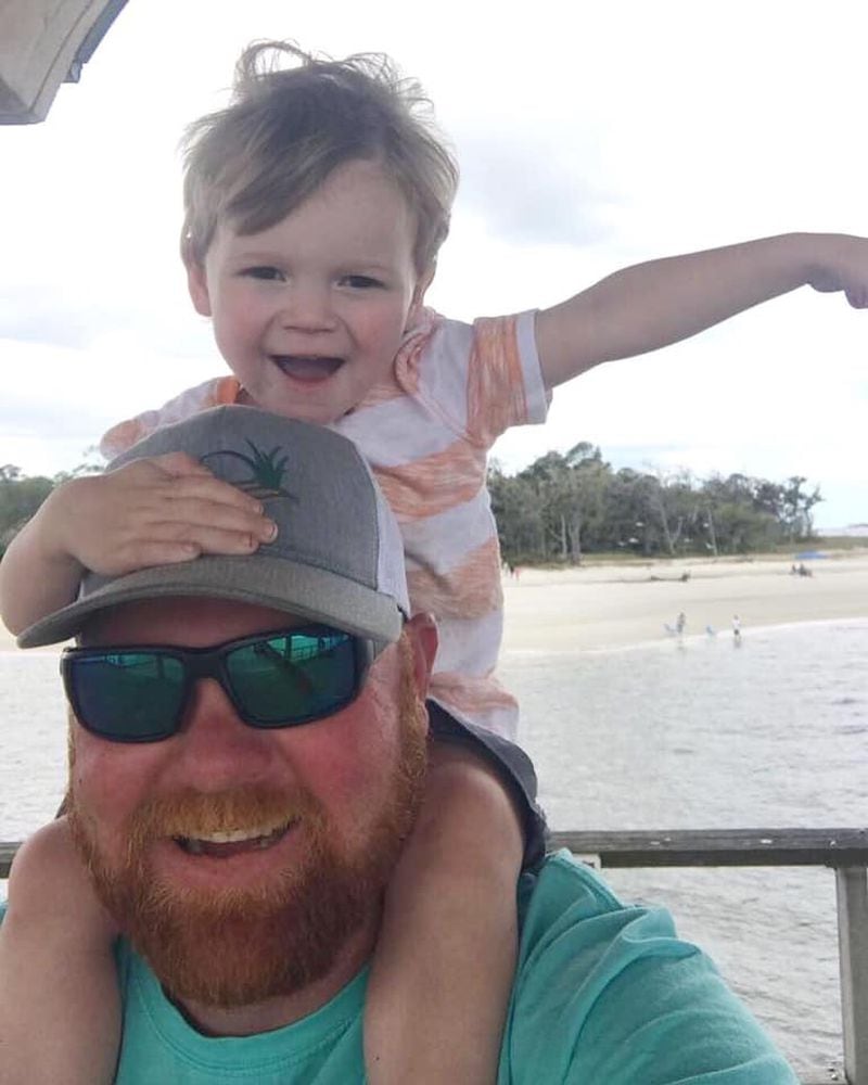 Travis McMichael, charged with the murder of Ahmaud Arbery, with his young son Everett. McMichael shot and killed Arbery in the Satilla Shores neighborhood near Brunswick on Feb. 23, 2020. (Family photo)