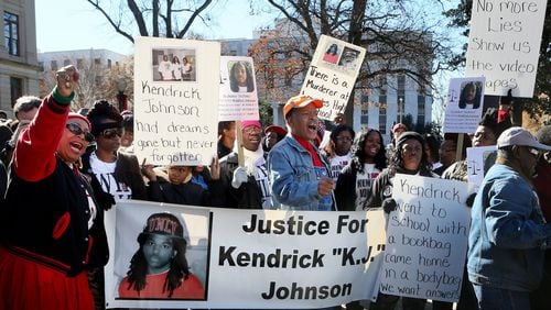 Protestors chant during a “Who Killed K.J.” rally for Kendrick Johnson in front of the Georgia State Capitol in December 2013. PHIL SKINNER / PSKINNER@AJC.COM