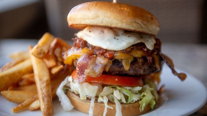Gwinnett County restaurants will offer speciality $7 burgers by taking part in the annual Gwinnett Burger Week, including this one, the Towne Center burger by Firebirds Wood Fired Grill in Peachtree Corners. (Courtesy of Firebirds Wood Fired Grill)
