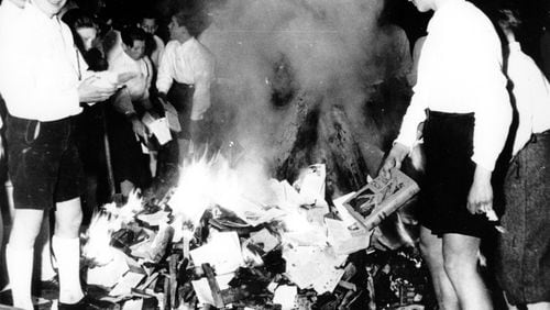 Members of the Hitler Youth participate in burning books in Salzburg, Austria, on April 30, 1938.  (Associated Press, File)