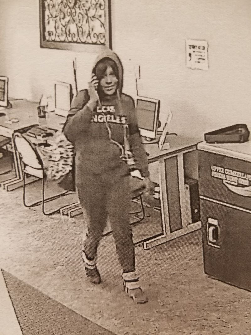 A woman believed by the FBI to be Nilsa Marie Urena during a robbery at a Tennessee credit union. (Credit: FBI)