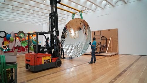 The reflective dish by Anish Kapoor, a fan favorite, won’t disappear. Here it is on the move to a slightly new location during the reinstallation of the permanent collection at the High Museum. CONTRIBUTED BY HIGH MUSEUM OF ART