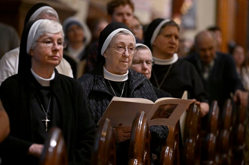 Nuns listen during a Pentecost Vigil at Blessed Michael McGivney Parish in St. Mary's Church, Saturday, May 18, 2024, in New Haven, Conn. The Eucharistic Procession from St. Mary's Church is one of four pilgrimage routes crossing the country and converging at the National Eucharistic Congress in Indianapolis, July 16. (AP Photo/Jessica Hill)