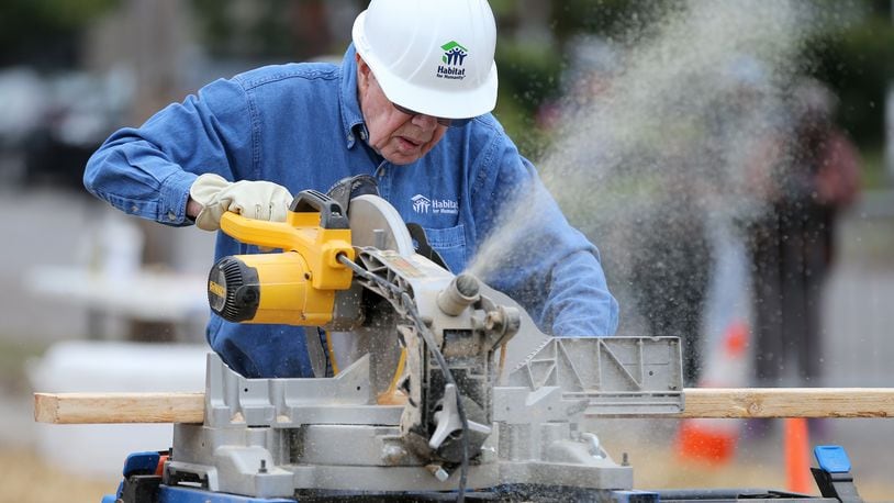 November 2, 2015 Memphis: Former President Jimmy Carter, cuts a 2x4 while working on a Habitat for Humanity construction site Monday morning November 2, 2015 in Memphis. Ben Gray / bgray@ajc.com