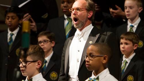David R. White, artistic director and conductor of the Georgia Boy Choir, works with his singers. The Atlanta-based choir offers musical education for boys from five years old through high school. Photo by Tim Redman