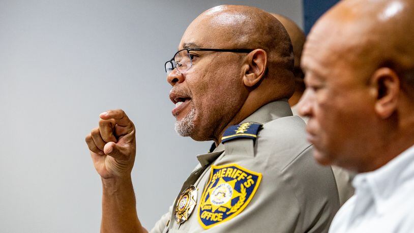 Gwinnett County Sheriff Keybo Taylor, with Cobb County Sheriff Clyde Owens, right, at his side on Tuesday, June 29, 2021. (Jenni Girtman for The Atlanta Journal-Constitution