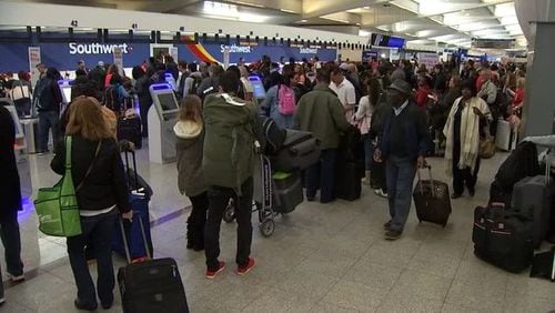 <p>Passengers waiting in line at Atlanta airport</p>