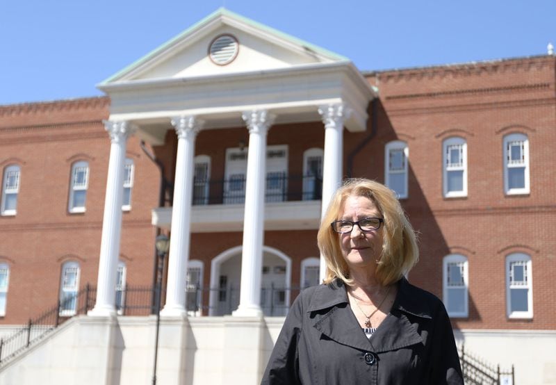 Sheryl Shinn, seen here outside the Gilmer County Courthouse in Ellijay, filed a lawsuit in 2007 against her former business partner. She blames his attorney, House Speaker David Ralston, for delaying the suit indefinitely, causing her to lose the company and file for bankruptcy. 