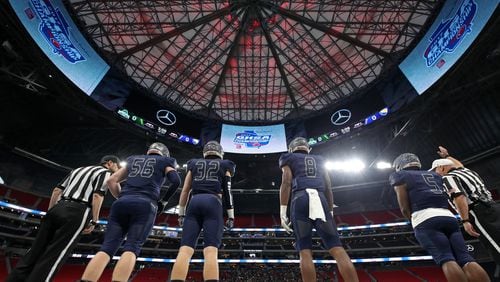 Eagle's Landing Christian captains Zack Jones (from left), George Shockley, Tre' Douglas and Josh Mays line up for the coin toss before Class A-Private Championship game against Athens Academy Dec. 8, 2017, at Mercedes-Benz Stadium in Atlanta.