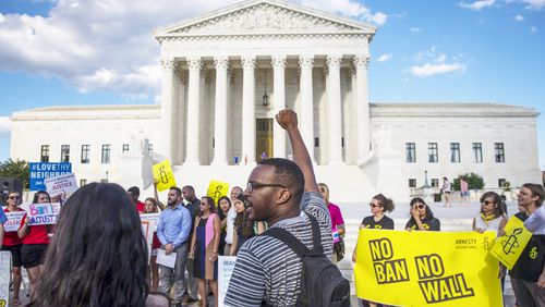 FILE — Protesters outside the Supreme Court after it announced that it would hear arguments on President Donald Trump’s revised travel ban, in Washington, June 26, 2017. (Al Drago/The New York Times)