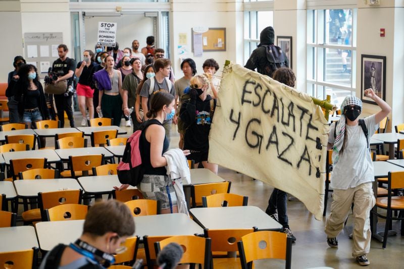 Protesters at Emory marched into Cox Hall near the quad during demonstrations Friday.