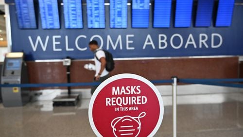 Travelers wearing face masks make their way to security checkpoints at Hartsfield-Jackson International Airport in Atlanta on Thursday, July 2, 2020. (Hyosub Shin / Hyosub.Shin@ajc.com)