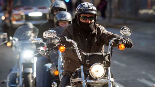 Motorcycle riders riding for the Combat Vets Association try and stay warm during The Georgia Veterans Day Parade in downtown Atlanta Saturday, November 11, 2017.