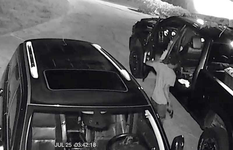 Surveillance footage from a Cherokee County home shows a man stealing a handgun from a pickup truck overnight. 