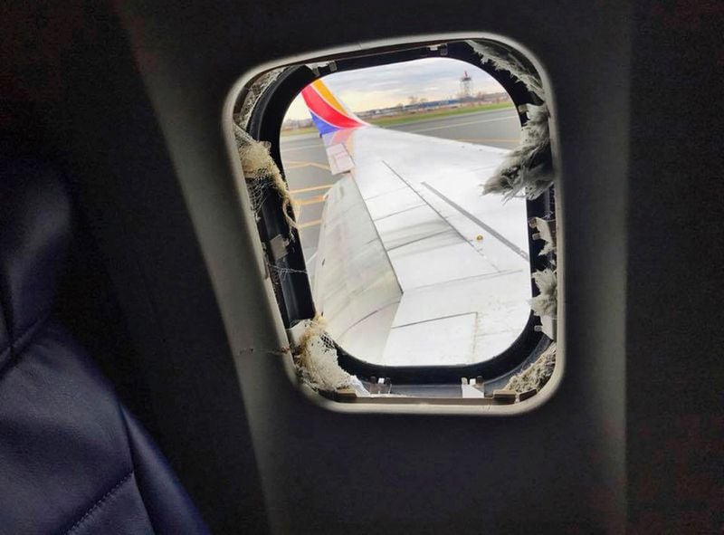 This April 17, 2018 photo provided by Marty Martinez shows the window that was shattered after a jet engine of a Southwest Airlines airplane blew out at altitude, resulting in the death of a woman who was nearly sucked from the window during the flight of the Boeing 737 bound from New York to Dallas with 149 people aboard, shown after it made an emergency landing in Philadelphia.