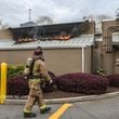 Atlanta firefighters battle blaze at a Midtown McDonald's after its marquee went up in flames Monday morning.