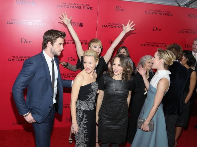 Jennifer Lawrence photobombs Liam Hemsworth, Elizabeth Banks, Nina Jacobson and Jenna Malone