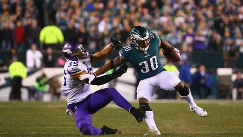 PHILADELPHIA, PA - JANUARY 21:  Corey Clement #30 of the Philadelphia Eagles uses a stiff arm against Anthony Barr #55 of the Minnesota Vikings during the second quarter in the NFC Championship game at Lincoln Financial Field on January 21, 2018 in Philadelphia, Pennsylvania.  (Photo by Mitchell Leff/Getty Images)