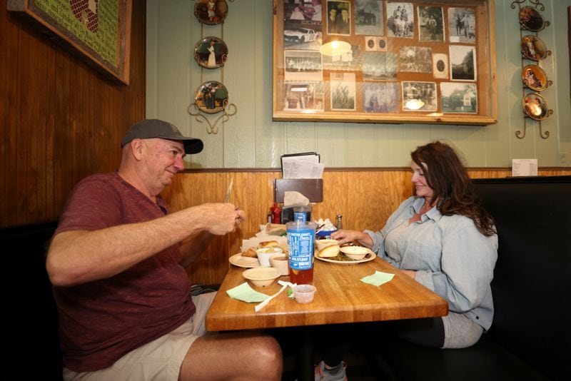 Customers David Greeson, left, and Starr Gragg eat lunch at Doug’s Place, a meat and three restaurant, on Old Allatoona Road, Thursday, November 3, 2022, in Emerson, Ga. (Jason Getz / Jason.Getz@ajc.com)