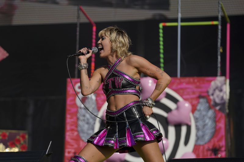 Miley Cyrus will perform at Music Midtown 2021 in Atlanta. (AP Photo/Doug Benc)