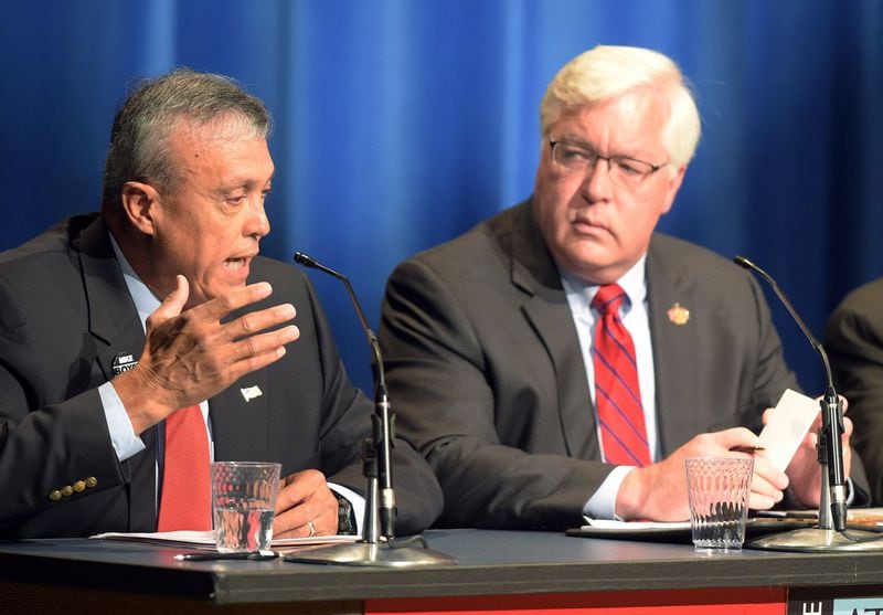 Cobb County Commission chair candidates Mike Boyce (left) and incumbent Tim Lee are shown during an Atlanta Press Club debate. (KENT D. JOHNSON/kdjohnson@ajc.com)