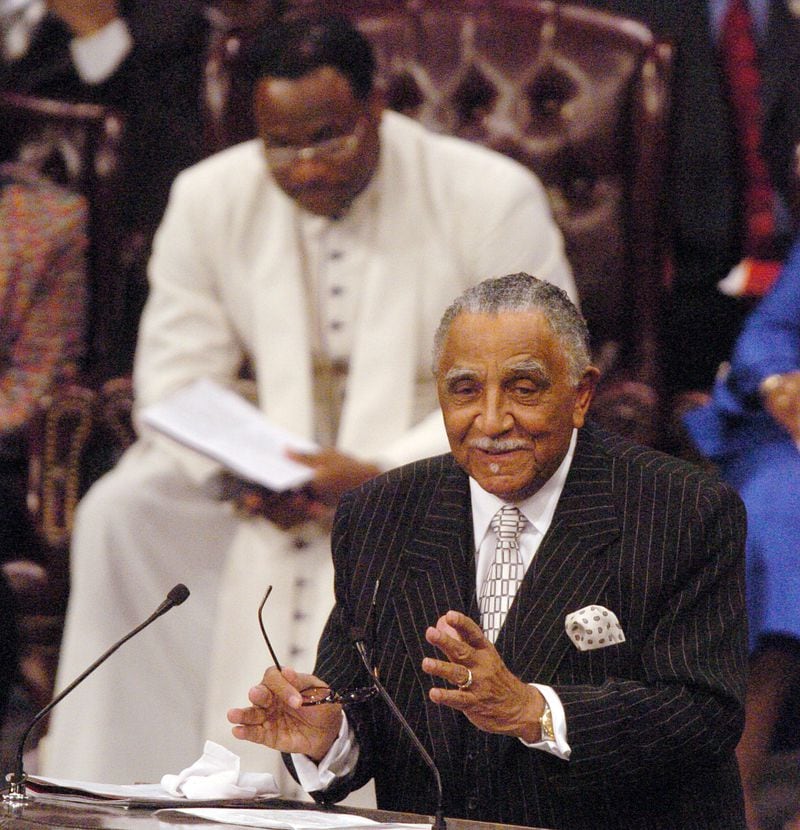 Rev. Joseph Lowery smiles as he honors King with some humor, with Bishop Eddie Long in the background.
