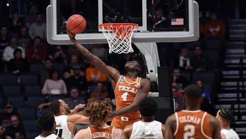 Mar 16, 2018; Nashville, TN, USA; Texas Longhorns forward Mohamed Bamba (4) shoots against the Nevada Wolf Pack during the first half in the first round of the 2018 NCAA Tournament at Bridgestone Arena. Mandatory Credit: Christopher Hanewinckel-USA TODAY Sports ORG XMIT: USATSI-378331 ORIG FILE ID: 20180316_ajw_ah2_085.jpg