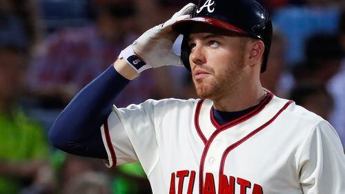 ATLANTA, GA - JUNE 25: Freddie Freeman #5 of the Atlanta Braves reacts after swinging through a pitch in the sixth inning against the New York Mets at Turner Field on June 25, 2016 in Atlanta, Georgia. (Photo by Kevin C. Cox/Getty Images)