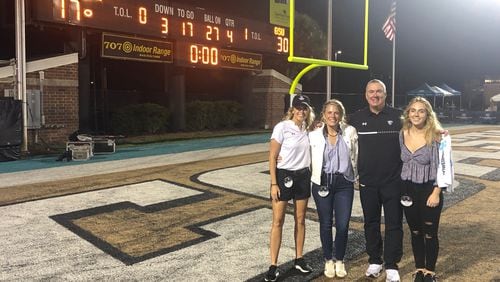 Three-quarters of the Elliott family celebrates Georgia State's 2023 victory over Coastal Carolina in Conway, S.C. (R-L) Maddyn Elliott, Shawn Elliott, Summer Elliott and longtime friend Ginny Thompson, GSU's director of on-campus recruiting and player personnel.