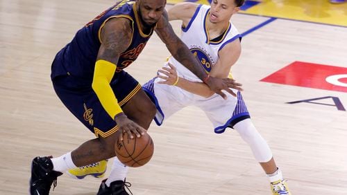 Play it again already: Golden State's Steph Curry pesters Cleveland's LeBron James during one of their many NBA Finals moments. (AP Photo/Eric Risberg, File)
