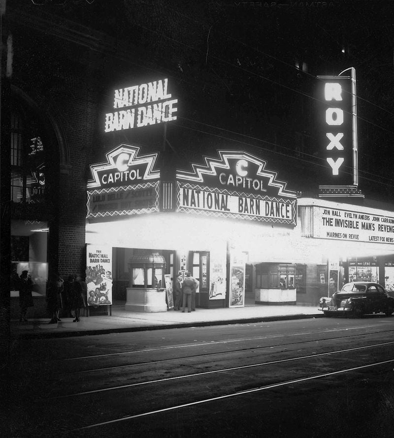 The Capitol Theatre: The Capitol sat right next door to the Roxy on Peachtree Street. It was built after its more famous neighbor and was gone earlier. It's seen here in 1944. Unlike the Roxy however, the building that the Capitol resided in is still there -- 200 Peachtree (the former downtown Macy's Building). The theater was housed where Meehan's Public House is today. (AJC file, AJCP315-053i GSU Special Collections)