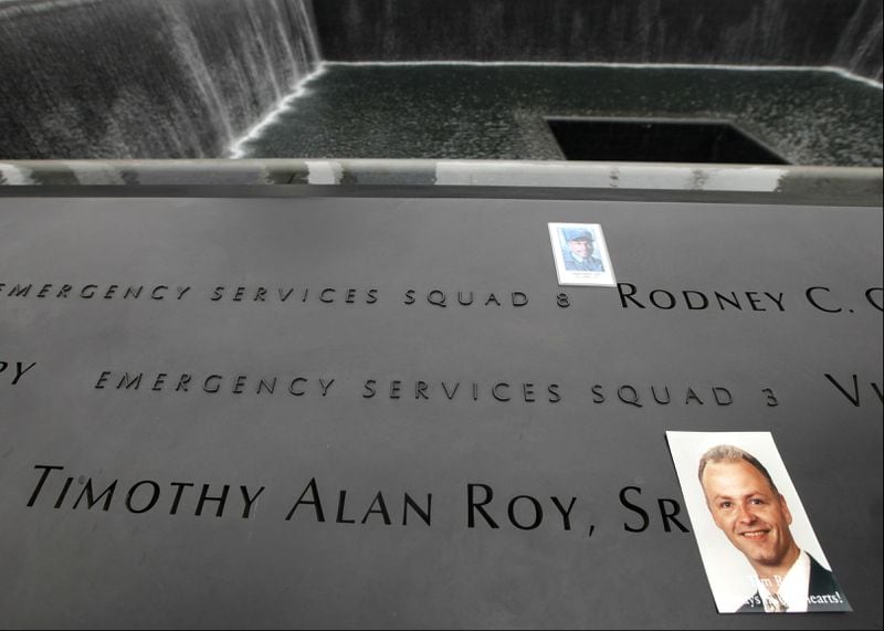 A photo of Timothy Roy Sr. sits near his name on the National September 11 Memorial during the 10th anniversary commemoration of the Sept. 11, 2001, terrorist attacks in New York City. Roy's daughter, Brittany Roy, followed in her father's footsteps and graduated from the New York police academy on Monday, Oct. 23, 2017.