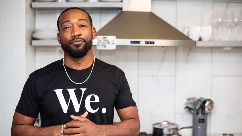 Health concerns pushed Issa Prescott, shown in his home kitchen in Midtown, toward changing his eating habits, and he eventually went vegan. Life Bistro, his restaurant, serves up plant-based versions of American comfort food. (Ryan Fleisher for The Atlanta Journal-Constitution)