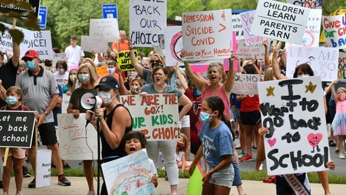 In August, parents, students and supporters rallied against Gwinnett County Public Schools' decision to make all fall instruction online-only due to rising COVID-19 infections. (Hyosub Shin / Hyosub.Shin@ajc.com)