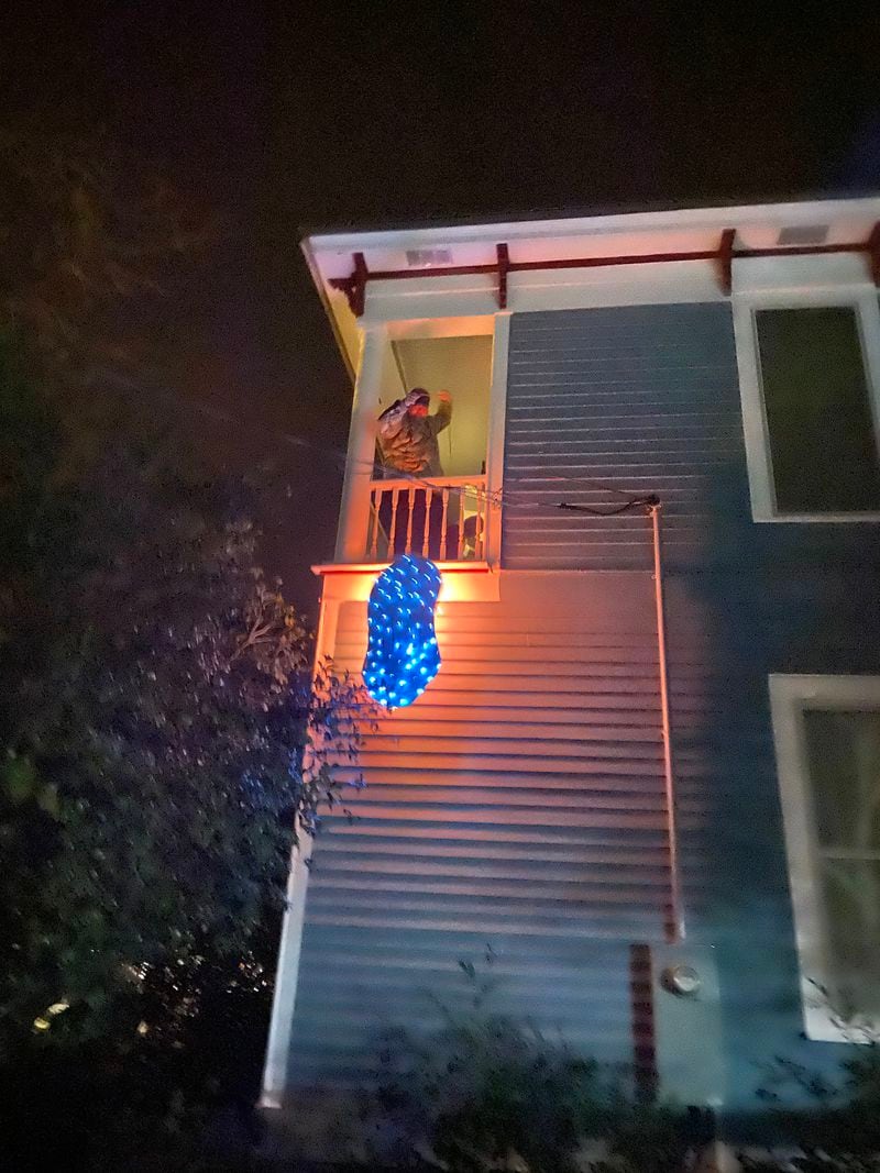 The Carters watched this blue peanut drop to the ground before they kissed on New Year's Eve.
