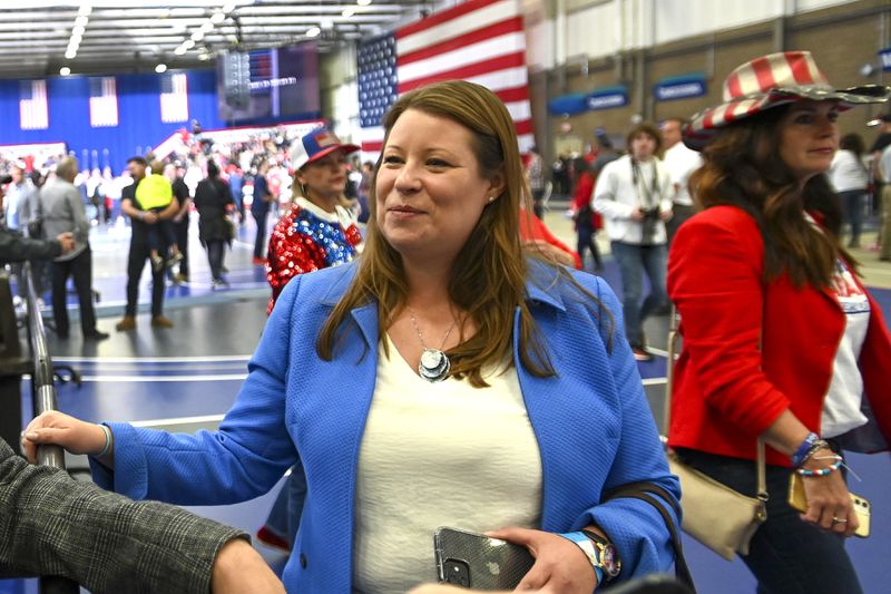 FILE - Stefanie Lambert attends a rally for Republican candidates at the Macomb Community College Sports & Expo Center in Warren, Mich., Oct. 1, 2022. Michigan Attorney General Dana Nessel announced charges Wednesday, May 8, 2024, against former Adams Township Clerk Stephanie Scott and her attorney, Lambert, who is pro-Trump, for allegedly allowing unauthorized access to a computer and its voter data in a search for fraud related to the 2020 election. (Todd McInturf/Detroit News via AP, File)