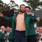 Scottie Scheffler receives the green jacket from 2023 winner Jon Rahm at the 2024 Masters Tournament at Augusta National Golf Club, Sunday, April 14, 2024. Jason Getz / Jason.Getz@ajc.com)
