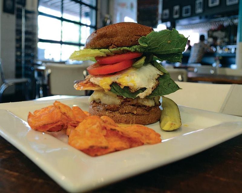 Local Republic serves up craft beer and creative burgers, like "The Sink," which which starts with a sunny side up egg, plus whatever else the kitchen wants to add on. PHOTO CREDIT: Ben Bailey