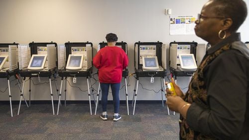 A Gwinnett County resident participates in early voting at the Gwinnett County Board of Voter Registration and Elections Building in Lawrenceville in February. (ALYSSA POINTER/ALYSSA.POINTER@AJC.COM)