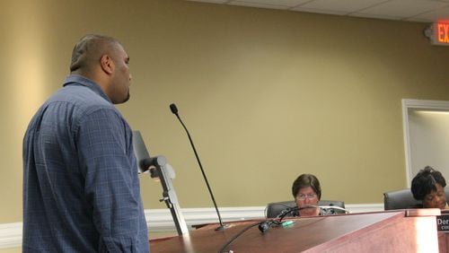 Shahid Khan addresses the Powder Springs City Council recently including Councilwoman Nancy Hudson, center, who opposed alcohol license applications. Carolyn Cunningham for the AJC