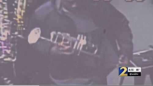 Surveillance footage from a used music store in Duluth appears to show a man zipping a trumpet underneath his jacket before leaving the store. The owner believes thieves have taken more than two dozen instruments from her shop.