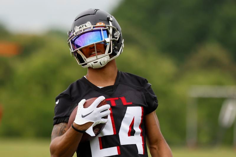 Falcons cornerback A.J. Terrell (24) runs with the ball after a catch during minicamp at the Atlanta Falcons Training Camp on Wednesday, June 14, 2023, in Flowery Branch, Ga.

 Miguel Martinez / miguel.martinezjimenez@ajc.com
