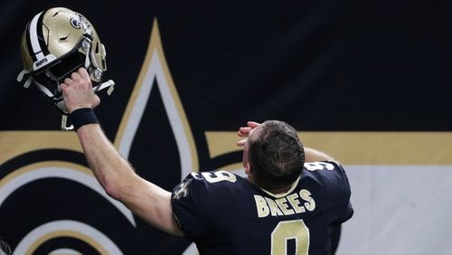 New Orleans Saints quarterback Drew Brees (9) acknowledges his family in the stands after a wild-card playoff game against the Chicago Bears Sunday, Jan. 10, 2021, in New Orleans. The Saints won 21-9. (AP Photo/Butch Dill)